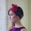 red vintage style fascinator with veiling