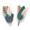 matching feather brooch and hair clip