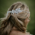 silver beaded hair chain side view with tassel at the back