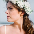 ivory flower crown with green leaves