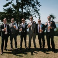 groomsmen with paper flower button holes