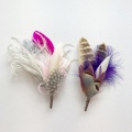 His and hers feather corsages