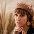 tan beret with feather hat pin holly young
