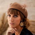 tan beret with pompom hat pin