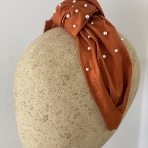 Rust orange silk knotted headband with pearls