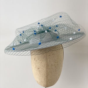 Light blue and green boater hat