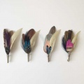 feather-buttonhole-pins-groomsmen.s