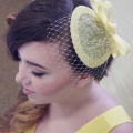 yellow fascinator with short veiling