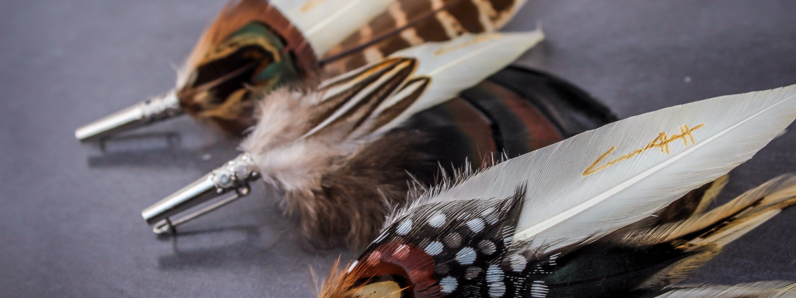 Feather Brooches and pins