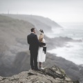 Bride and groom on Boho cliffs