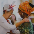 mother of the bride and groom in stunning headwear