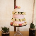 Wild wedding cake with roses and macaroons