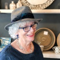 grey marl trilby with peacock feather ribbon