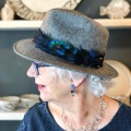 grey marl trilby with peacock feather ribbon