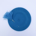 Turquoise beret with Pom Pom pin