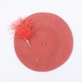 Nectarine beret with orange Pom Pom pin