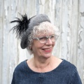 Grey beret with black Pom Pom pin