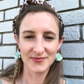 green earrings and leopard print headband