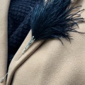 Black feather hat and lapel pin Holly Young