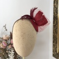 red fascinator for a wedding