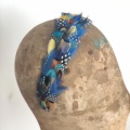 Blue yellow and spotty feather head band