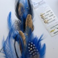 Gold Swarovski crystals on blue feathers