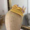 yellow vintage fascinator with veil