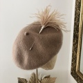 Tan beret feather hat pin