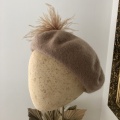 beret with feather hat pin camel