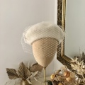 ivory beret with bird cage veil
