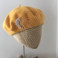 Yellow beret with veil