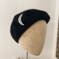 moon brooch on black beret Holly Young
