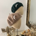 berets with brooches