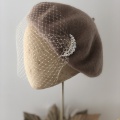 light brown beret with veiling