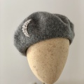 grey marl beret with moon brooch