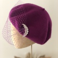 beret with veiling and moon brooches