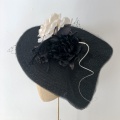 Large black and white occasion hat