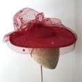 Red boater hat with pink spot veiling