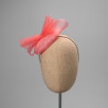 Coral cocktail hat for wedding guest