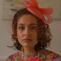 Coral cocktail hat with optional veil