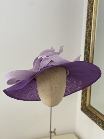 Purple wide brimmed occasion hat