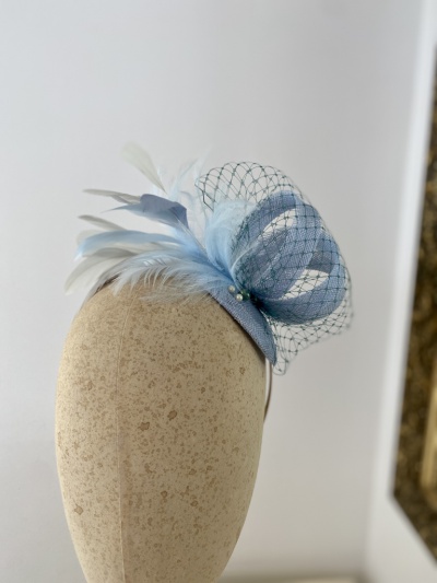 Light blue green headpiece for a wedding