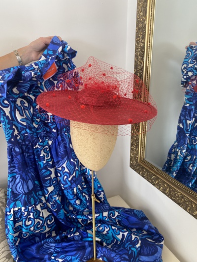Red boater hat with spot veiling