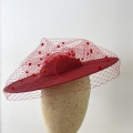 Red boater hat with polka dot veil
