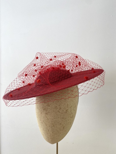 Red boater hat with polka dot veil