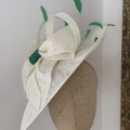 Ivory and green mother if the groom hat