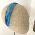 Bespoke turquoise feather headband with veil