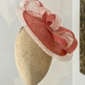 Coral disk hat for mother of the groom