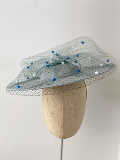 Light blue and green boater hat