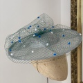 Blue and green boater hat for ascot